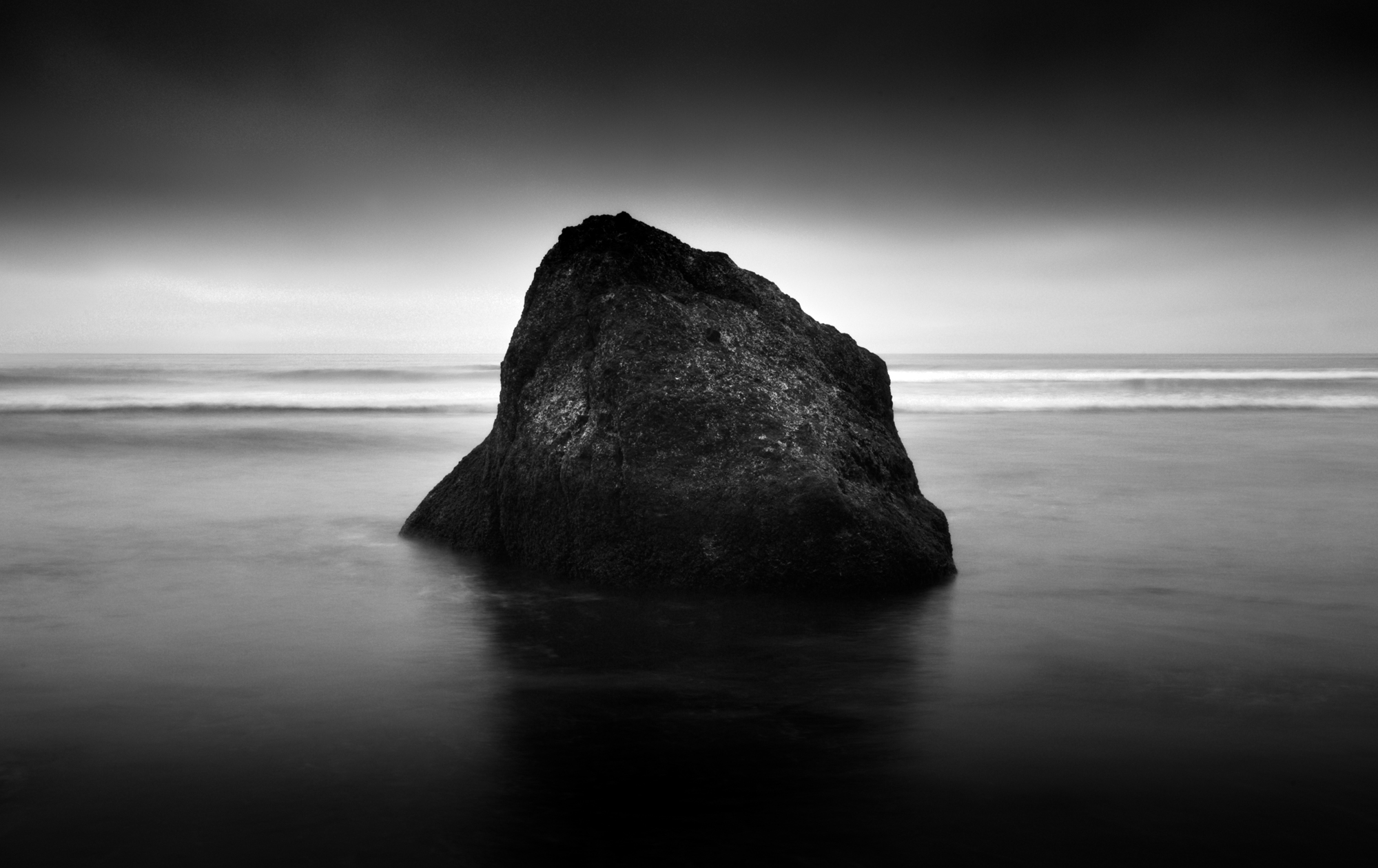 Ruby Beach at Dusk, a black and white stock photograph of an isolated rock on Ruby Beach.